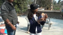 Teenage girl seemingly able to read and identify distant objects blindfolded