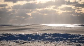 Amazing footage of frozen surf on the New York coast during brutal Polar Vortex