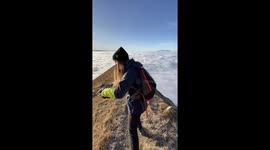 This astonishing footage shows the heavenly video of a beautiful travel junkie taking a run in a location that makes her appear to be running the clouds.