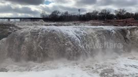 Blowing foam and a flood warning for Big Sioux River