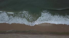 Amazing aerial view of Atlantic waves hitting New York beach