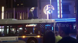 Drunk Climbs on Top of Bus