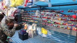 U.S. Marine fails to shoot down cuddly toys from fairground stand in Thailand