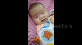 Funny video of a newborn baby farting in front of his parents