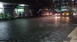 Buses drive through flooded roads in the Philippines