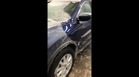 Thick ice completely covering a car