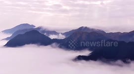 Sea of clouds flow over Chinese mountains in this spectacular drone footage