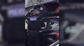 UK police crack open car roof box and discover stowaway hiding inside