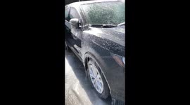 Taking thick layer of ice off cars