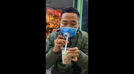 The man created a mask to drink water in public to ensure safety before the Coronavirus (COVID-19) in Viet Nam