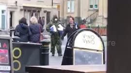 Bizarre moment UK man in full army combat gear and face mask spotted shopping for toilet paper