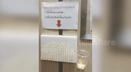 Worried Thai locals use toothpicks and cotton buds to avoid touching lift buttons amid coronavirus outbreak