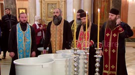 Clergymen splashing holy water on central streets of Tbilisi