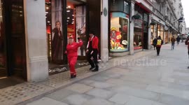 Staff at Hamleys Toy Shop In Regents Street Try To Cheer The Public Up During The Coronvirus Outbreak