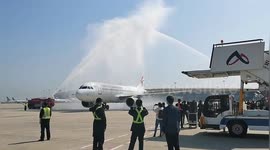 Chinese airport welcomes home flight carrying coronavirus medical workers with water arch