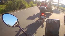 Motorcycle passes through coronavirus lock down check point in the Philippines