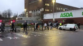 Hundreds queue at ASDA Watford England UK as Coronavirus leads to panic buying