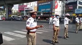 Traffic police in south India educate commuters on COVID-19 precautions