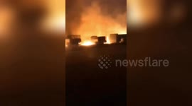 Huge fire spreads in strong winds, burning several vehicles in northern China