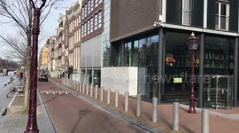 Skaters in front of closed Anne Frank House due to corona-crisis