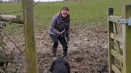 Lady gets foot stuck in muddy field laughing out loud