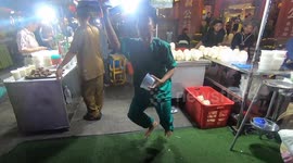 Malacca street food performance show coconut ball