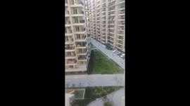 Indian residents ring bells and clap to show their appreciation for emergency workers during the COVID-19 pandemic