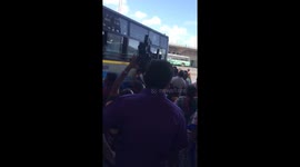 Milling crowds wait at Koyambedu bus stand to go home