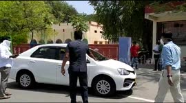 Government officials make drivers turn back as India imposes coronavirus restrictions