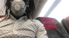 Passengers wearing masks board almost-empty flight from Manchester to Norway