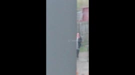 Lady sings in garden during lockdown