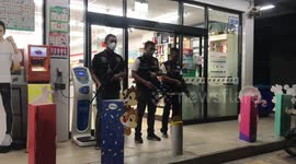 Armed police guard supermarkets in Thailand amid fears of coronavirus crime surge