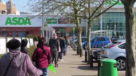 Long Queues for Supermarkets as Coronavirus Social Distancing restrictions imposed on shoppers shopping for essentials.