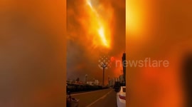 Thick smoke caused by huge mountain fire turns sky orange in China
