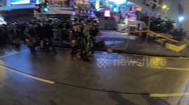 Hong Kong Police transport three persons arrested for not respecting the order on interdiction of gathering in more than 4 people