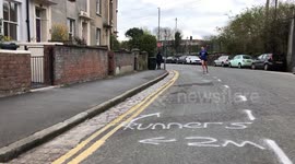Residents in UK city draw two-metre marking for joggers to keep their distance