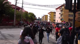 People protesting from the balconies of their apartments next to the march