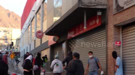 Small civil war in Chile, people fighting each other, one side wants to steal the super market and another defends it, part 5/8