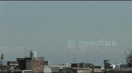 Indian city under COVID-19 lockdown sees Himalayas after thick pollution clears
