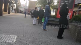 People Queue To Get Into MArks And Spencers Due To Social Distancing