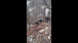 a terrible accident, the girl landed out of the way because she was driving fast and was barely rescued, tree trunks rescued her and people stopped on their way to get help. the video was taken on a mountain called 