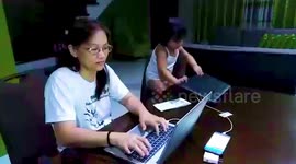 Adorable toddler copies her mother while she works at home due to Covid-19