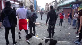 People lighting a bonfire while waiting to confront the military and special forces
