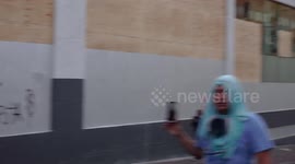 Police attacking protesters with tear gas, cameraman in the midst of chaos