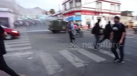 Police attacking protesters with tear gas