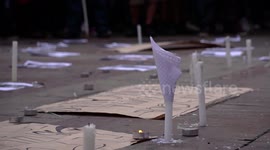 People amid the protests paying tribute to disappeared detainees, murdered, tortured