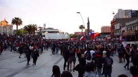 People jumping in the protest with screams and songs in the main square of the city