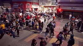 People retreating to their homes after the march, others remain to confront the police