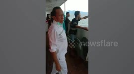 Passengers jump overboard a blocked Indonesian ferry over coronavirus fears