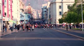 Large numbers of people head downtown to protest in the city center